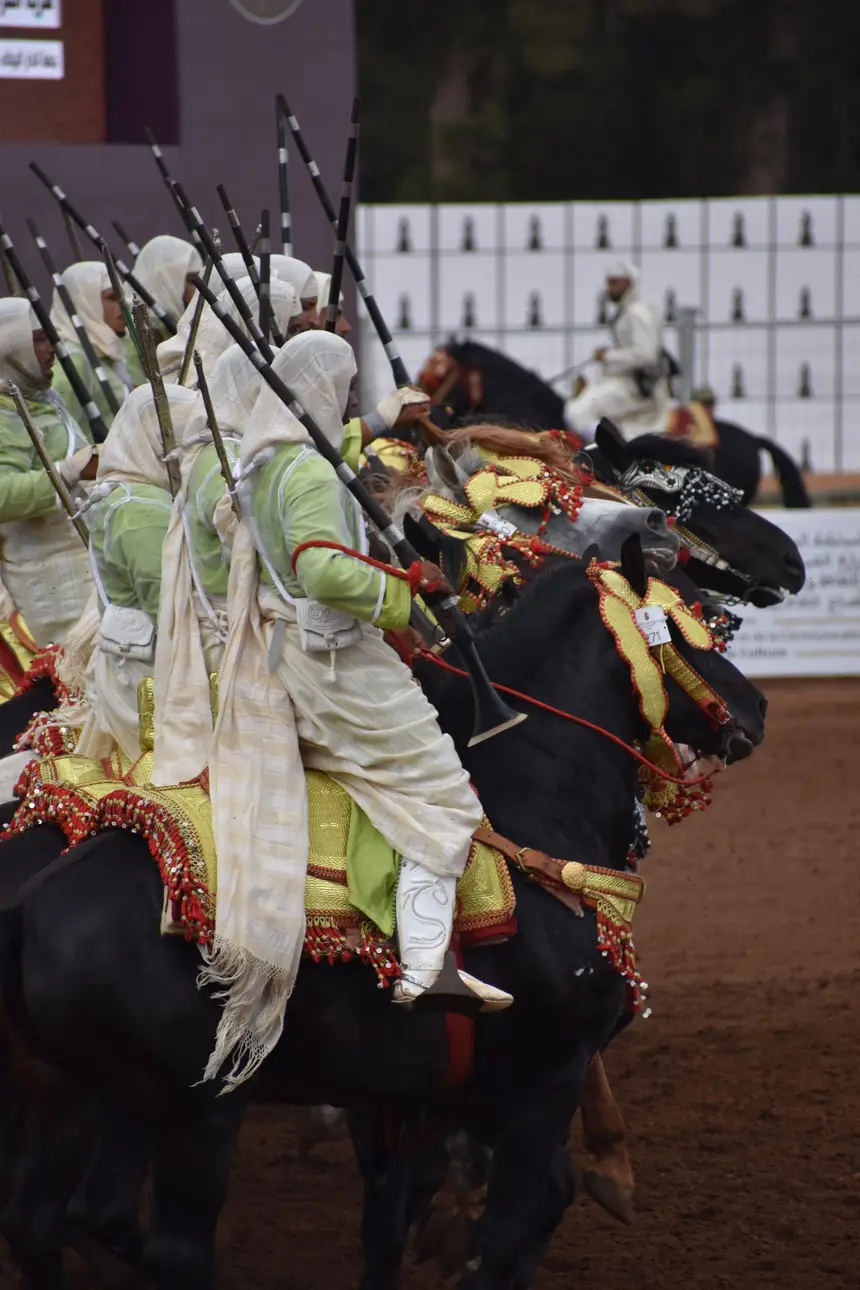 Tbourida fantasia print — Moroccan horsemen charging through gunpowder smoke (BWK-715), photograph by Saida