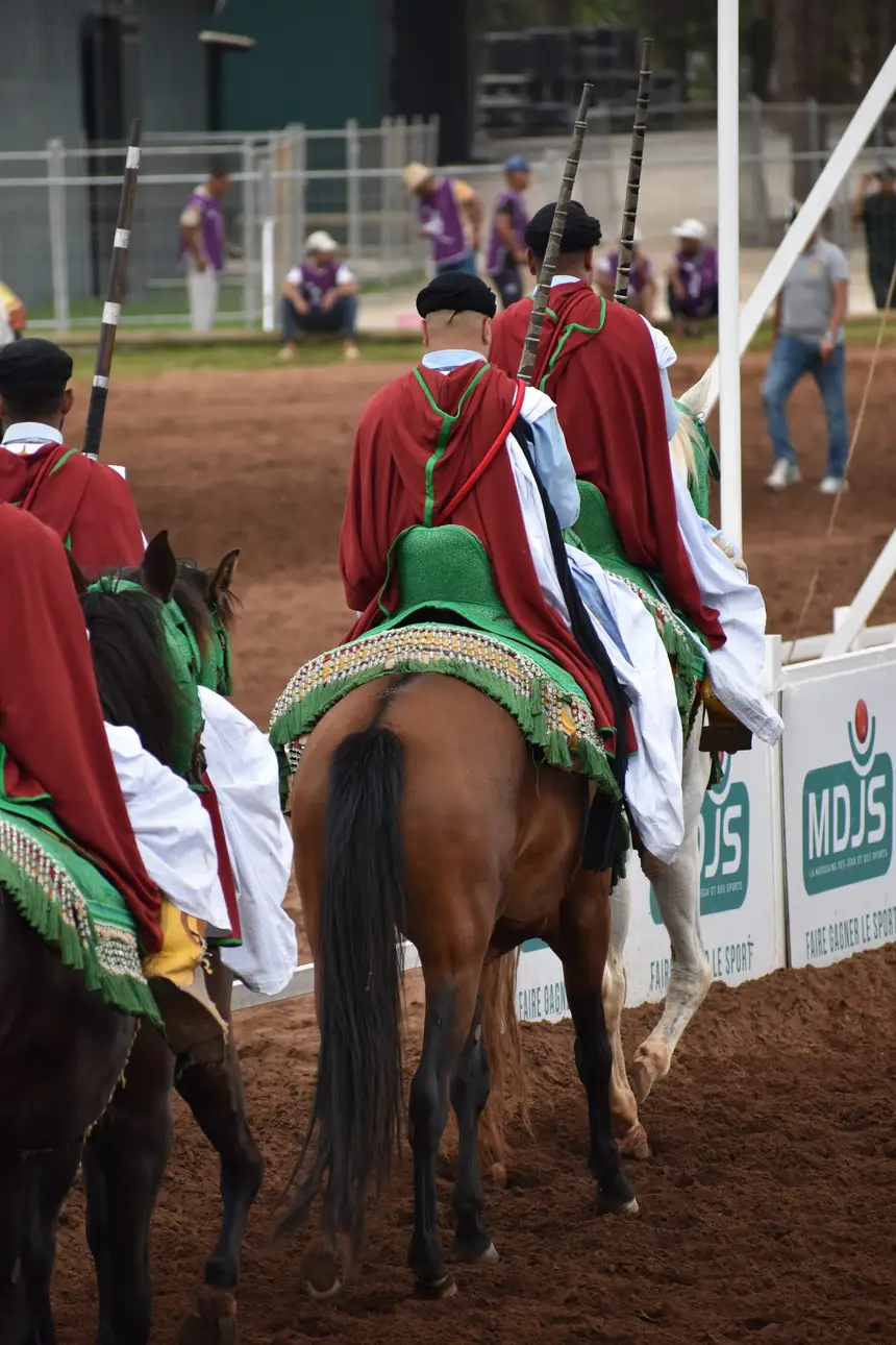 Tbourida fantasia print — Moroccan horsemen charging through gunpowder smoke (BWK-721), photograph by Saida