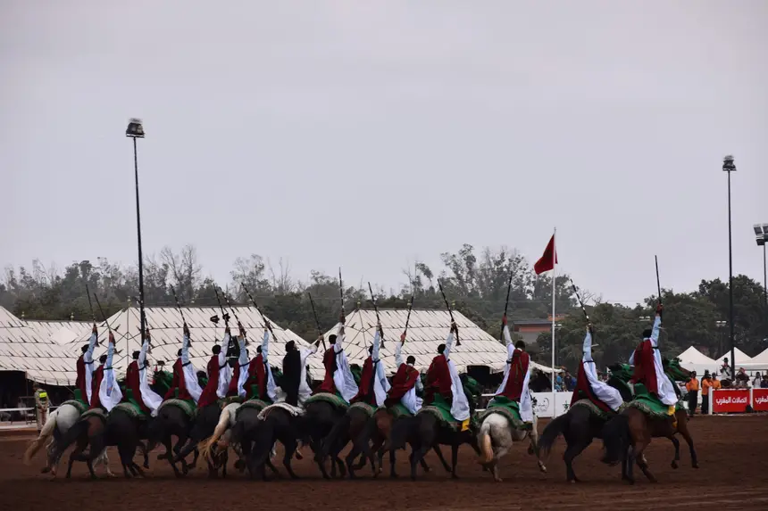 Tbourida fantasia print — Moroccan horsemen charging through gunpowder smoke (BWK-722), photograph by Saida