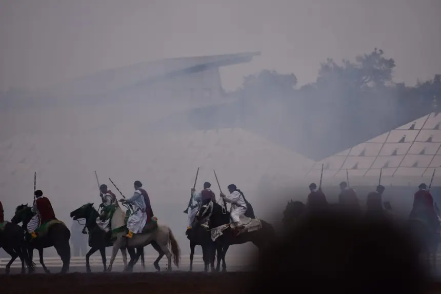 Tbourida fantasia print — Moroccan horsemen charging through gunpowder smoke (BWK-728), photograph by Saida