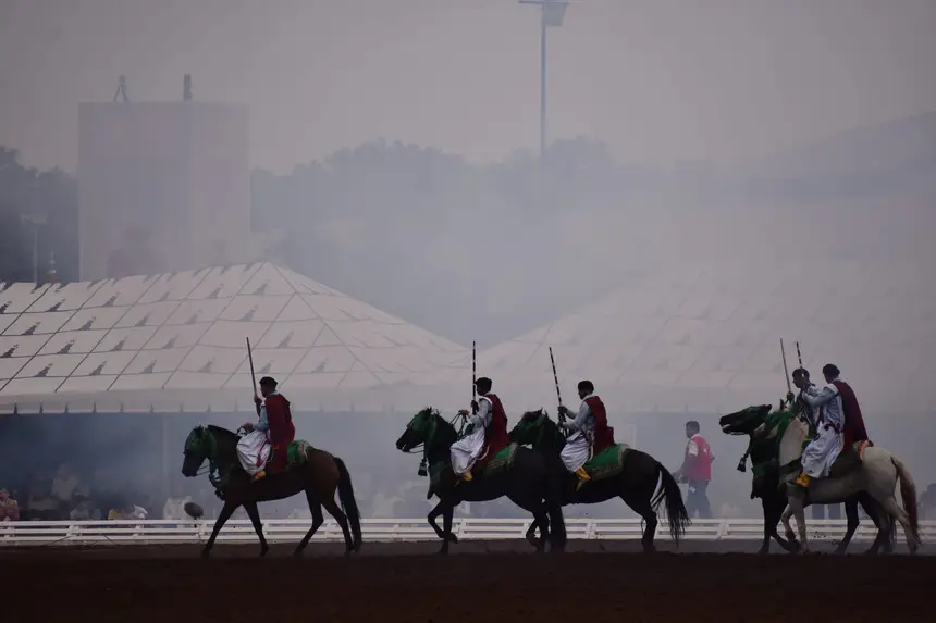 Tbourida fantasia print — Moroccan horsemen charging through gunpowder smoke (BWK-729), photograph by Saida