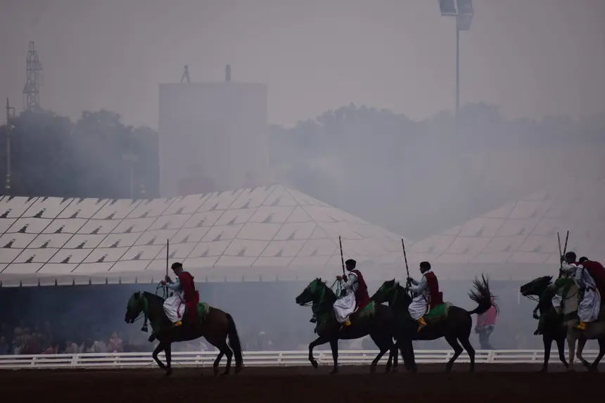 Tbourida fantasia print — Moroccan horsemen charging through gunpowder smoke (BWK-730), photograph by Saida
