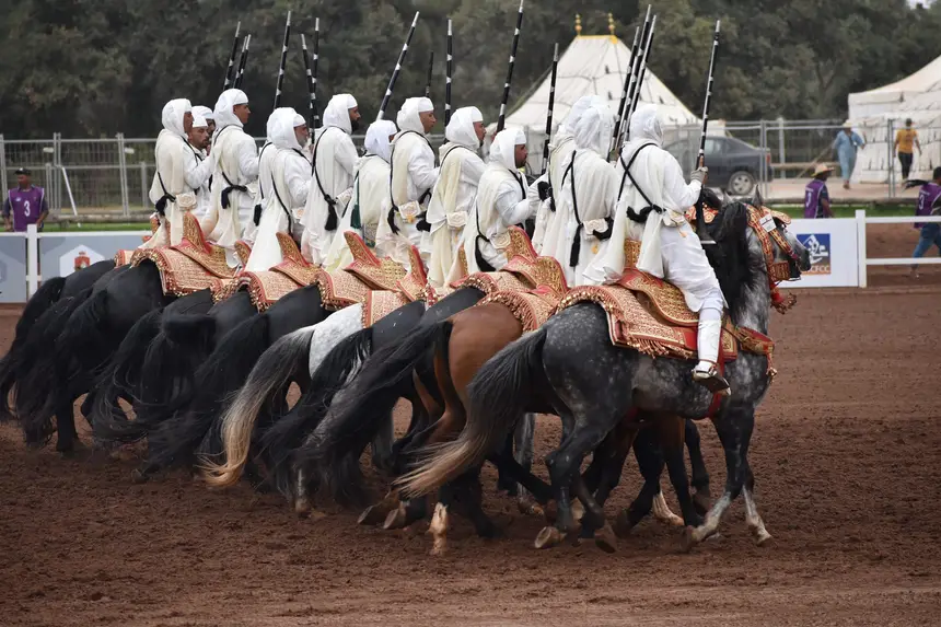 Tbourida fantasia print — Moroccan horsemen charging through gunpowder smoke (BWK-741), photograph by Saida