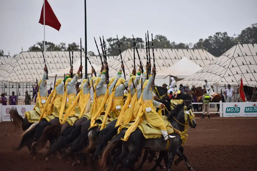 Tbourida fantasia print — Moroccan horsemen charging through gunpowder smoke (BWK-742), photograph by Saida