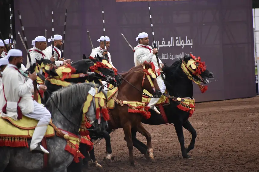 Tbourida fantasia print — Moroccan horsemen charging through gunpowder smoke (BWK-749), photograph by Saida